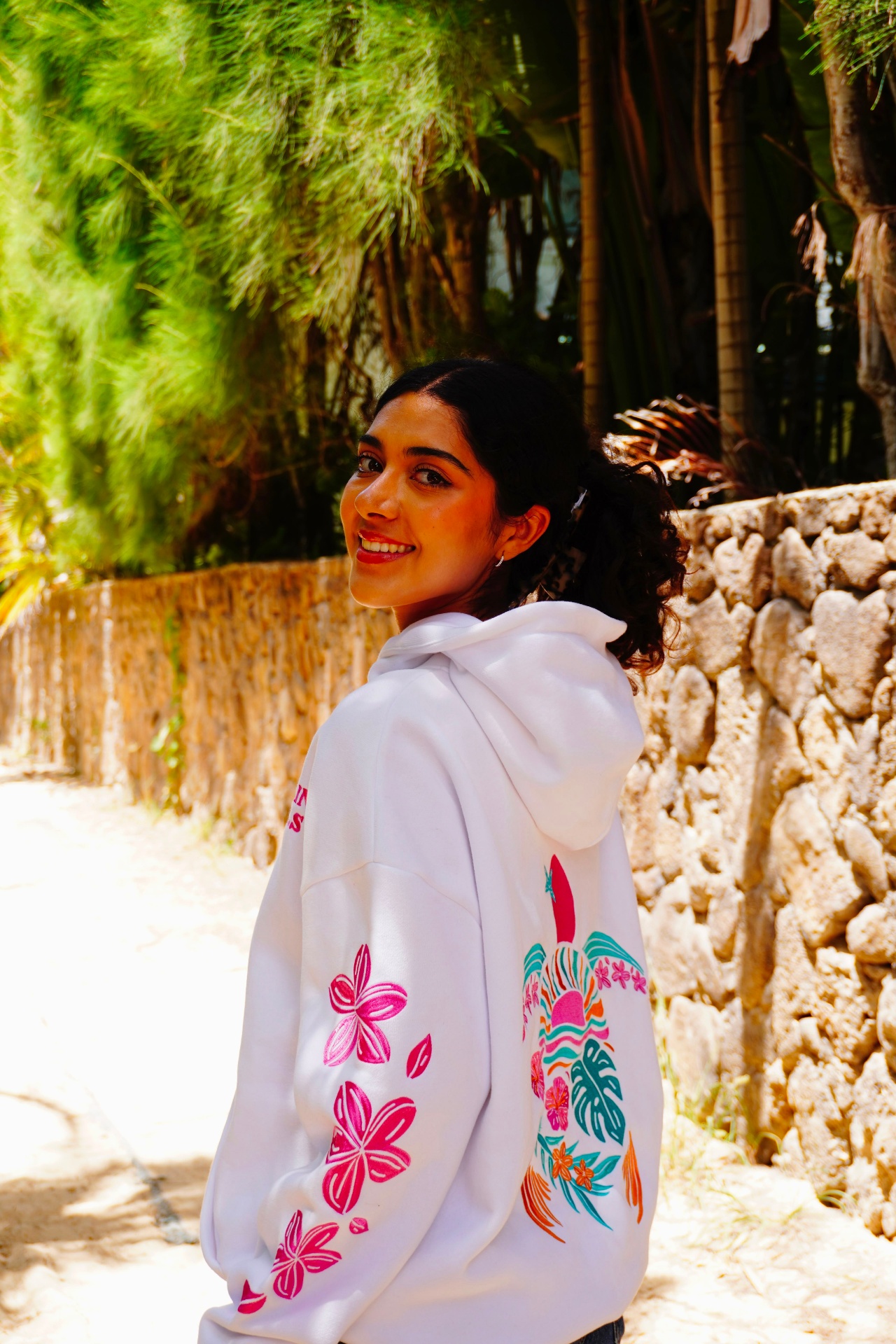 Island Bloom hoodie — worn on the beach in Hawaii